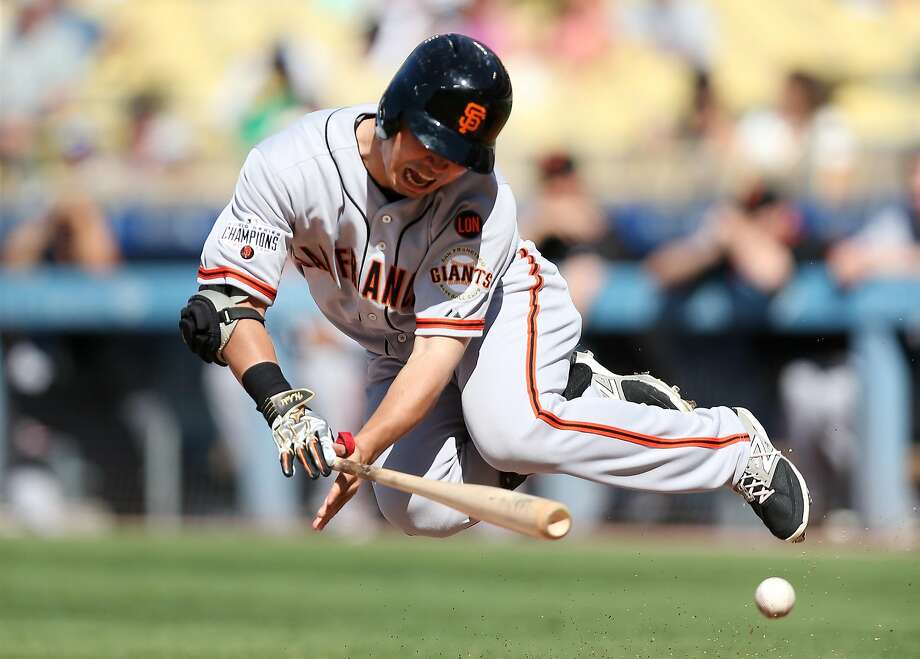 LOS ANGELES, CA - JUNE 20: Nori Aoki #23 of the San Francisco Giants goes down after being hit by a pitch in the anke in the first inning against the Los Angeles Dodgers at Dodger Stadium on June 20, 2015 in Los Angeles, California.  (Photo by Stephen Dunn/Getty Images) Photo: Stephen Dunn, Getty Images