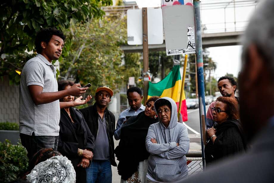 Ash Gichamo speaks at a candlelight vigil in the spot where Yonas Alehegne, an Ethiopian immigrant, was shot and killed by an Oakland police officer in August, in Oakland, Calif., on Sunday, September 13, 2015.  Gichamo didn't know Alehegne but says there's a lot of Ethiopians in that neighborhood.  "It could have been me," he said. Photo: Sarah Rice, Special To The Chronicle
