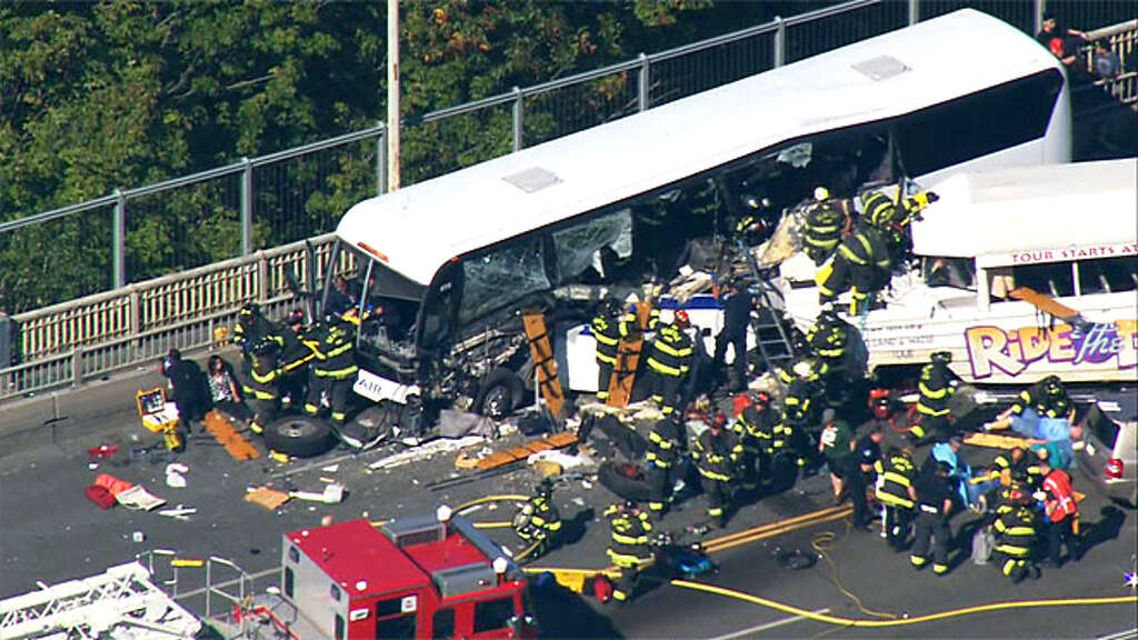 Two fatalities and nine critical injuries were reported after a Ride the Ducks duck boat collided with a charter bus on Aurora Bridge in central Seattle. Photo: KOMO