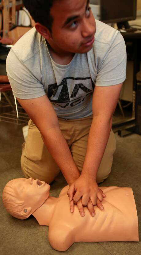 Jonathan Cerrato Cruz from Ali Mayer's 9-12 grade Health Education class at Abraham Lincoln High School practices Hands Only CPR on Monday, Oct. 5, 2015 in San Francisco, Calif. Photo: Nathaniel Y. Downes, The Chronicle