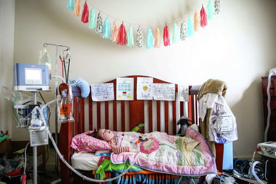 Kai Victoria, 3, rests in the bedroom of her northeast Seattle home on Tuesday, October 13, 2015. Kai is on a ventilator and is cared for around the clock at home by her mother and a team of nurses. She is one of four Washington children involved in a lawsuit meant to force the state to provide better, less-expensive care to ventilator-dependent kids. Photo: JOSHUA TRUJILLO, SEATTLEPI.COM / SEATTLEPI.COM
