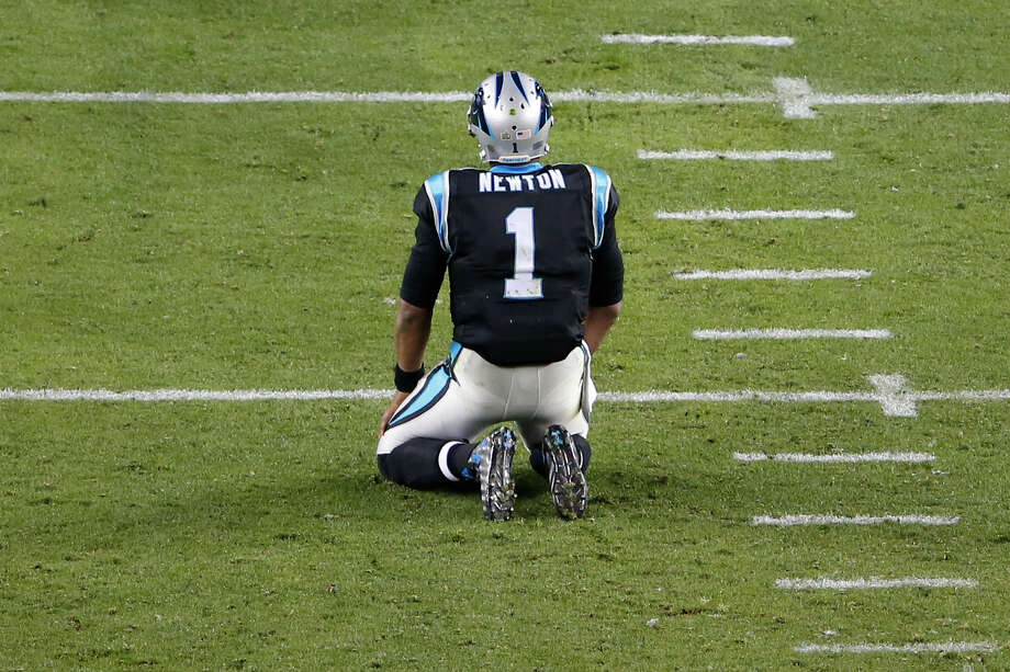 Carolina Panthers quarterback Cam Newton kneels on the field after fumbling in the fourth quarter against the Denver Broncos in Super Bowl 50 at Levi’s Stadium in Santa Clara, Calif. Newton was sacked six times and fumbled twice. Photo: Aj Mast /New York Times / NYTNS