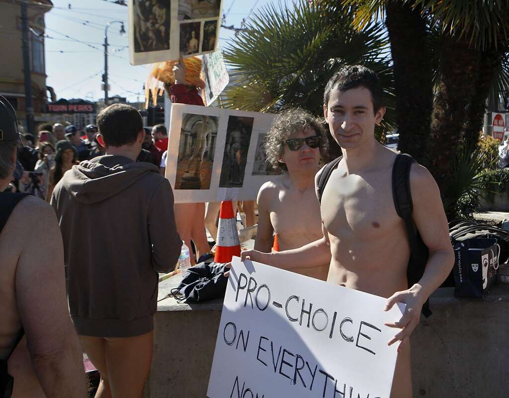 Jeff, a participant at the first annual Valentine's Nude Parade, put together by the Body Freedom Network, holds a sign reading 'Pro-Choice on everything' in San Francisco, Calif., on Saturday Feb. 13, 2016 Photo: Brittany Murphy, The Chronicle