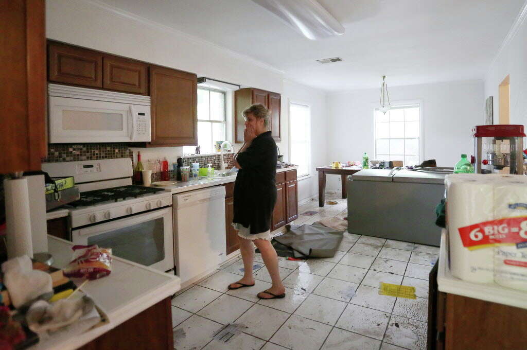 Kelly Gorrell, who moved into her Meyerland home in January, reacts while seeing it for the first time, Monday, April 18, 2016, in Houston. Photo: Jon Shapley, Houston Chronicle / © 2015  Houston Chronicle