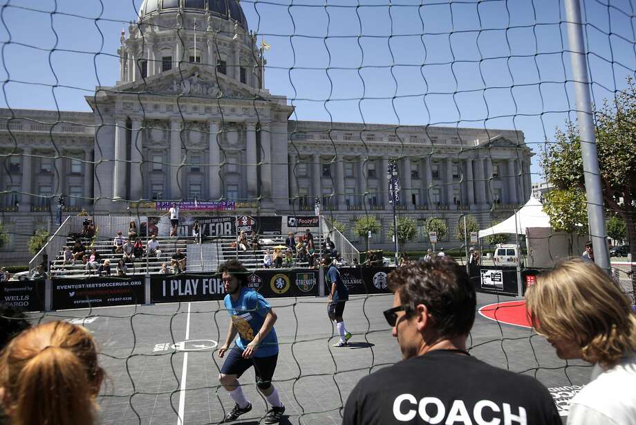 San Francisco’s Mario Estrada (center) plays against Seattle at the 2014 Street Soccer USA tournament in Civic Center Plaza. Photo: Leah Millis, The Chronicle