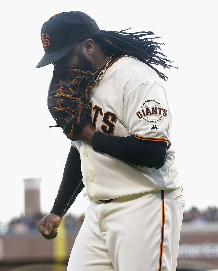 San Francisco Giants pitcher Johnny Cueto yells into his glove after Washington Nationals' Tanner Roark hit an RBI single during the second inning of a baseball game in San Francisco, Thursday, July 28, 2016. (AP Photo/Jeff Chiu) Photo: Jeff Chiu, Associated Press