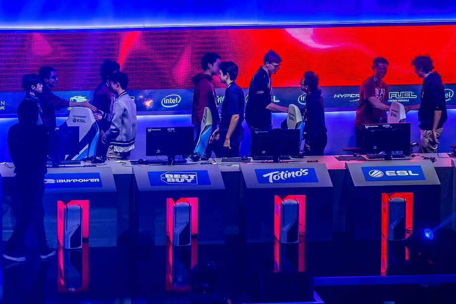 Stanford and UC Berkeley students shake hands, following a League of Legends match during the Intel Extreme Masters at the Oracle Arena on Saturday, Nov. 19, 2016 in Oakland, Calif. Stanford won the game. Photo: Santiago Mejia, The Chronicle