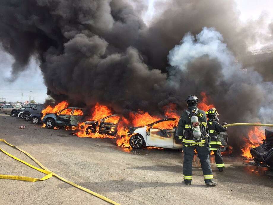 A fire swarmed through 35 cars at an auto auction dealership Saturday evening, officials said.