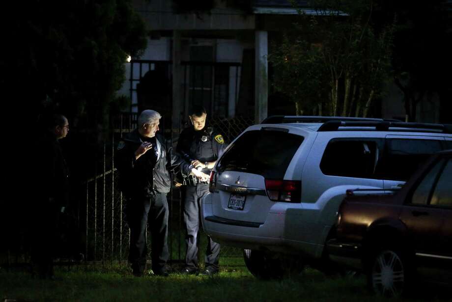 Officers investigate a scene in the 6000 block of Shotwell where a man was shot early Tuesday morning. The man is expected to survive. Authorities say the suspect in the shooting, Russell Cormier, has not been found. Photo: Godofredo A. Vasquez, Staff / Godofredo A. Vasquez