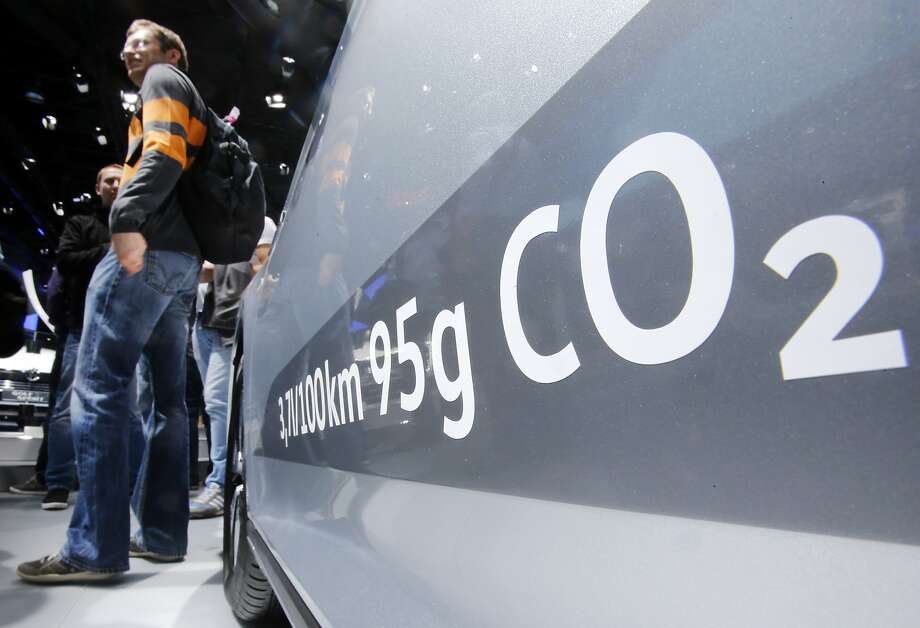 FILE - In this Sept. 22, 2015, file photo, the amount of carbon dioxide emissions is written on a Volkswagen Passat Diesel at the Frankfurt Car Show in Frankfurt, Germany. On Friday, April 21, 2017, a judge ordered Volkswagen to pay a $2.8 billion criminal penalty in the United States for cheating on diesel emissions tests, blessing a deal negotiated by the government for a massive fraud orchestrated by the German automaker. (AP Photo/Michael Probst, File) Photo: Michael Probst, Associated Press