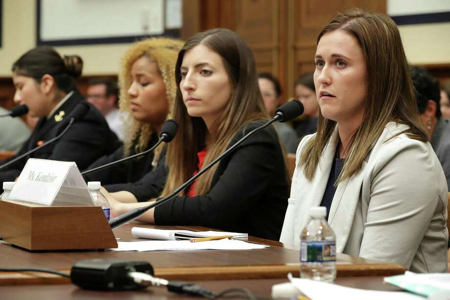 WASHINGTON, DC - MAY 02:  Former U.S. Naval Academy Midshipman Annie Kendzior (R), testifies before the House Armed Services Committee's Subcommittee on Military Personnel with fellow sexual assault survivors (2nd R-L) former U.S. Military Academy cadets Stephanie Gross andAriana Bullard and Naval Academy Midshipman Second Class Shiela Craine in the Rayburn House Office Building on Capitol Hill May 2, 2017 in Washington, DC. Recruited as a student athelete, Kendzior was twice raped after enrolling at the Naval Academy in 2008. After reporting the crime she said the superintendent at the time told her to "grow up." The academy superintendents were called to testify following the release of a survey last month by the Pentagon that said 12.2 percent of academy women and 1.7 percent of academy men reported experiencing unwanted sexual contact during the 2015-16 academic year. The number of reports at West Point increased from 17 to 26, while reports at the Naval Academy ticked up from 25 to 28 over the last academic year.  (Photo by Chip Somodevilla/Getty Images) Photo: Chip Somodevilla, Staff / Getty Images / 2017 Getty Images
