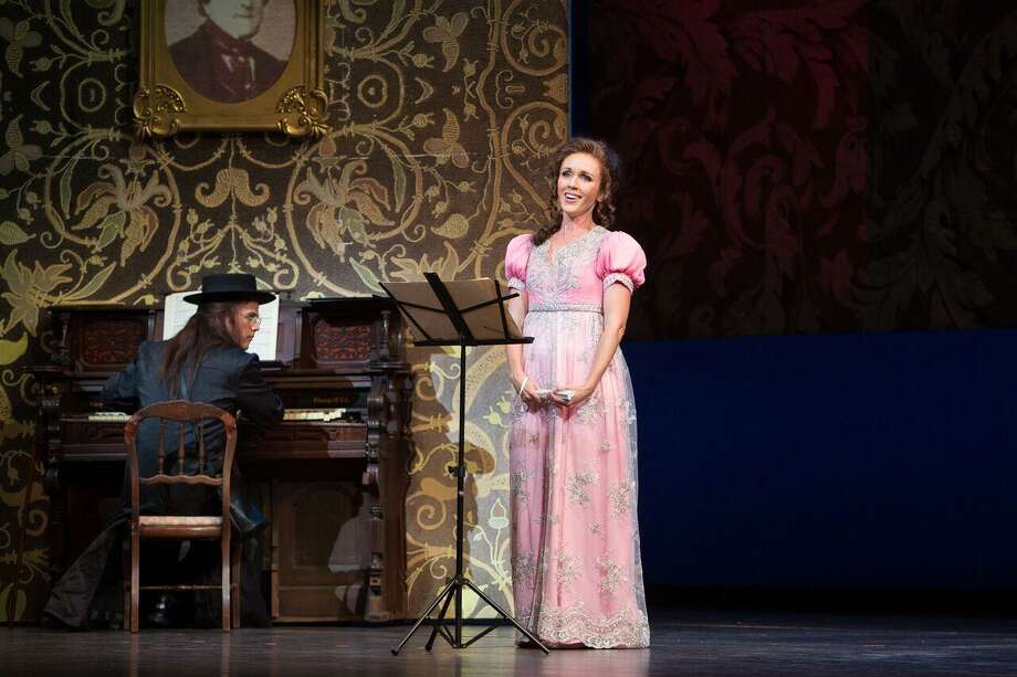 Soprano Sarah Coburn, portraying Rosina, takes a music lesson from Count Almaviva, played by tenor Andrew Owens, in Opera San Antonio's "The Barber of Seville." Photo: Marty Sohl Photography / Marty Sohl Photography