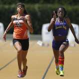 Santa Rosa High School's Kirsten Carter and Chinyere Okoro from Amador Valley High finish in first and second place respectively in the girls 100 meter run at the North Coast Section Meet of Champions in Berkeley, Calif. on Saturday, May 27, 2017.