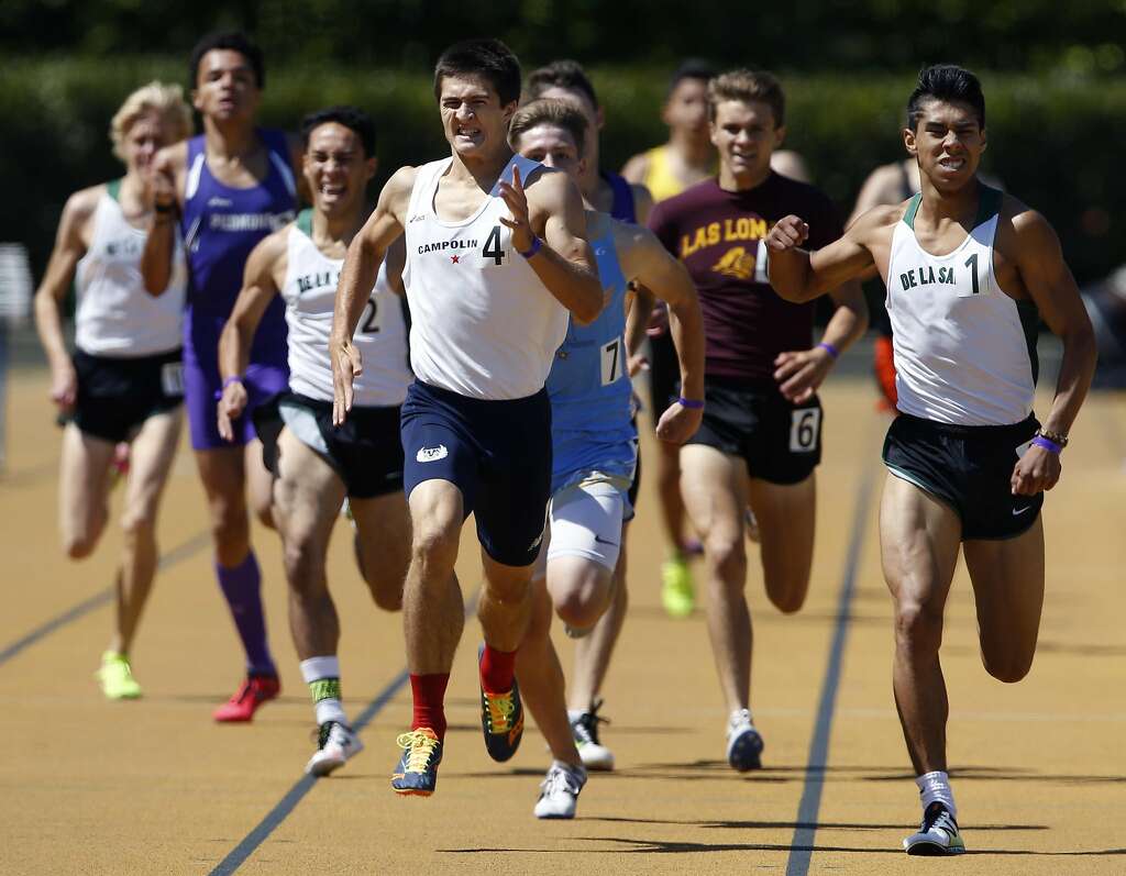 Campolindo's Niki Moore (center) edges out De La Salle High's Isaias De Leon (right) and the rest of the field to take first place in the boys 800 meter run at the North Coast Section Meet of Champions in Berkeley, Calif. on Saturday, May 27, 2017. Photo: Paul Chinn, The Chronicle