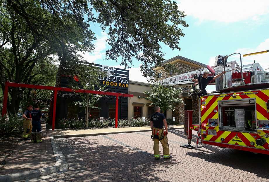 Houston firefighters extinguished a small fire that was located in a hood vent of the pizza oven at the Ruggles Black Food Bar restaurant Wednesday, June 14, 2017, in Houston. Photo: Godofredo A. Vasquez