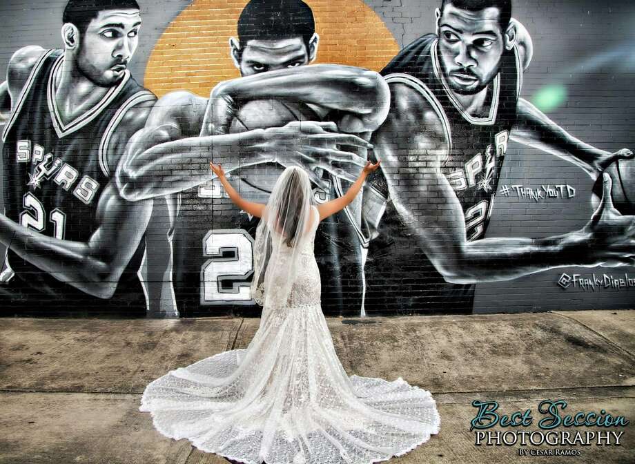Natalie Vallejo, a devout Spurs fan, incorporated Nik Soupe's Tim Duncan mural into her bridal photos before she married David Vallejo.  Photo: Courtesy, Natalie Vallejo 