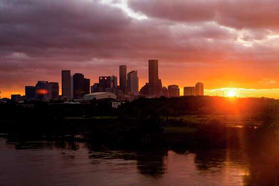 The sun sets over the Houston skyline as Tropical Storm Harvey moves out of the region Tuesday, Aug. 29, 2017. ( Michael Ciaglo / Houston Chronicle)