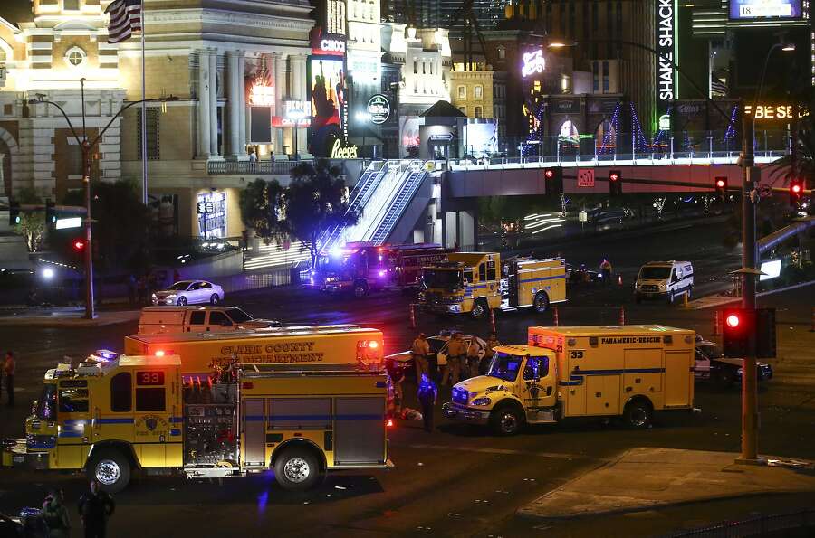 Las Vegas police and emergency vehicles sit on scene early on Monday, October 2nd, 2017, following a deadly shooting at a music festival on the Las Vegas Strip.  Photograph: Chase Stevens/Associated Press.
