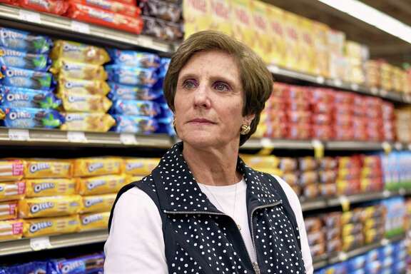 Irene Rosenfeld, retiring chief executive of Mondelez International, checks out a snack food aisle at a store in Northbrook, Ill.﻿