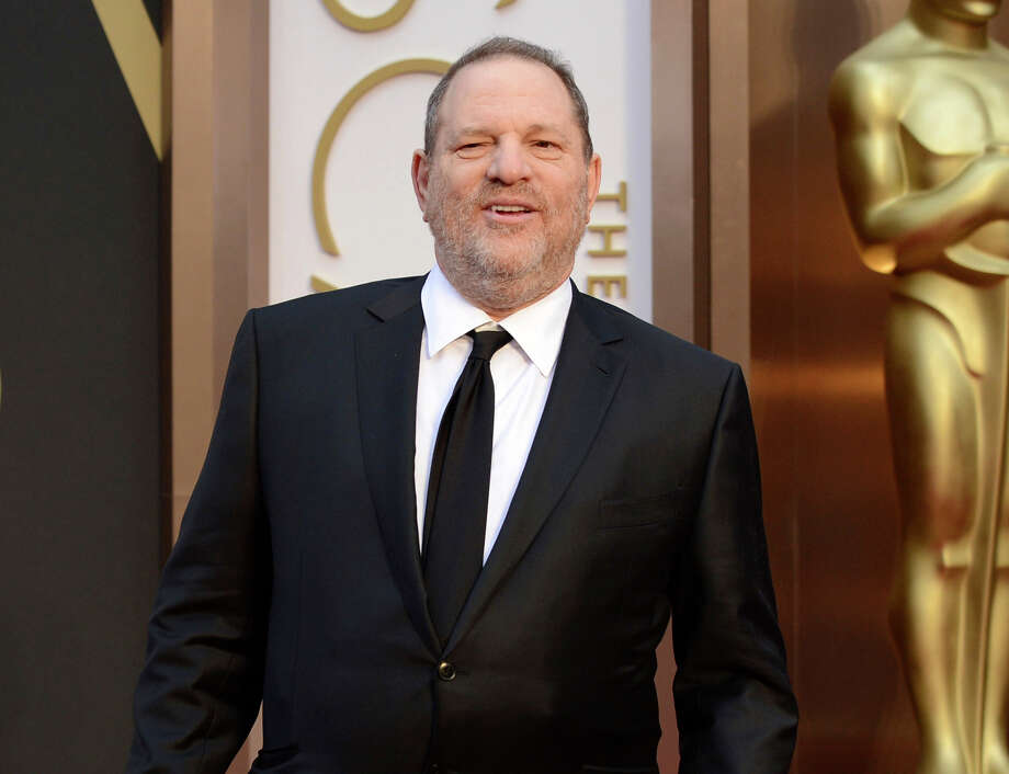 FILE - In this March 2, 2014 file photo, movie mogul Harvey Weinstein arrives at the Oscars at the Dolby Theatre in Los Angeles. Two recent lawsuits have made the unorthodox legal argument that Harvey Weinstein's pursuit of young women, and his attempts to quiet sexual assault accusations, effectively amounted to organized crime. (Photo by Jordan Strauss/Invision/AP, File) ORG XMIT: NYR403 Photo: Jordan Strauss / Invision