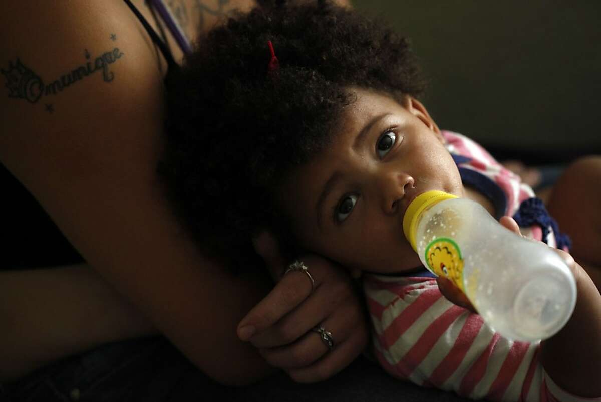 LaMya Deshana Price sucks on an empty bottle as she tries to fall asleep on her mother's lap on Wednesday, November 6, 2013, in Hayward, Calif. Photo: Lacy Atkins, The Chronicle