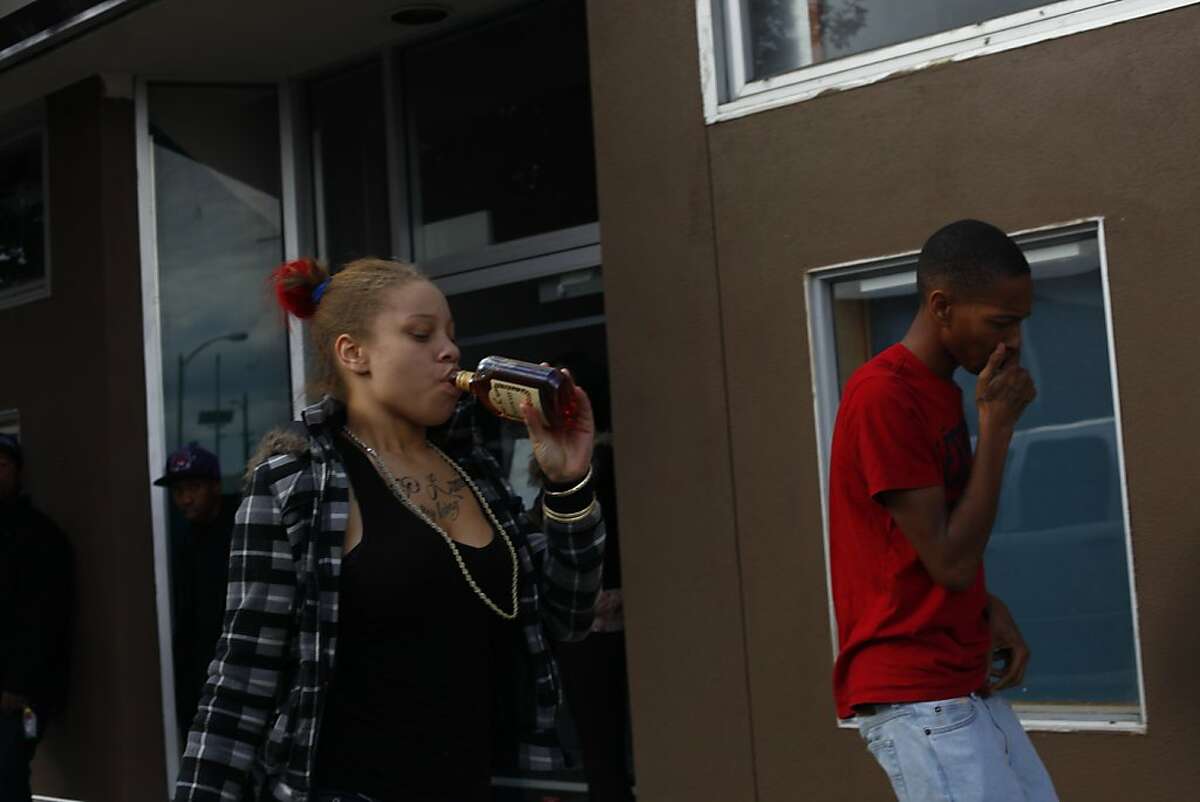 Brijjanna Price,  16, walks with her older brother Ramon Price Jr., 18,  through the neighborhood known as "The Murder Dubbs,&quot, two weeks after their brothers funeral, in February 2012,  in Oakland, Calif. Photo: Lacy Atkins, The Chronicle