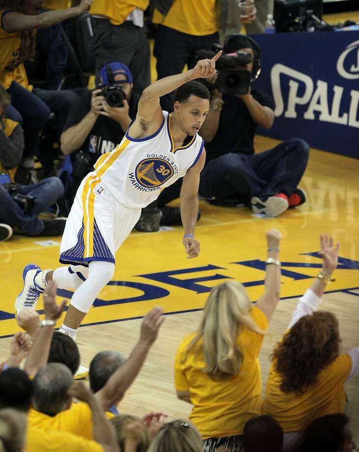 Stephen Curry (30) celebrates a three point shot during the first half. The Golden State Warriors played the Memphis Grizzlies at Oracle Arena in Oakland, Calif., in Game 1 of the Western Conference Semifinals on Sunday, May 3, 2015. Photo: Carlos Avila Gonzalez, The Chronicle