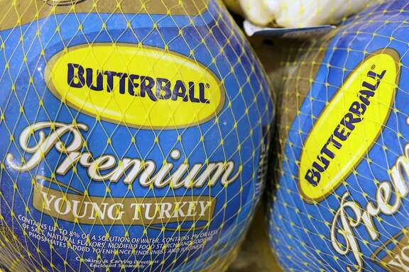 FILE - In this file photo made Dec. 7, 2009, Butterball frozen turkeys are on display at Heinen's grocery store in Bainbridge Township, Ohio. Butterball, which has been fielding phone calls from Thanksgiving cooks for more than 35 years, is letting people text their turkey-related questions this year for the first time. The company�s regular phone help line begins Tuesday, Nov. 1, 2016. Butterball will start take text message questions on Nov. 17, 2016, and continue through Thanksgiving Day. (AP Photo/Amy Sancetta, File)