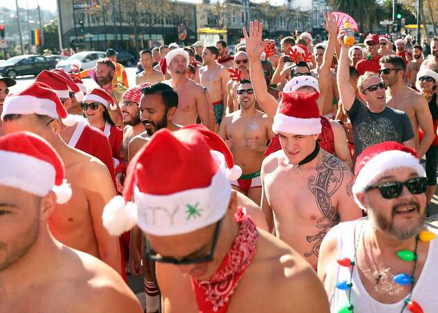 Runners in scanty Santa gear show colors for AIDS/HIV benefit